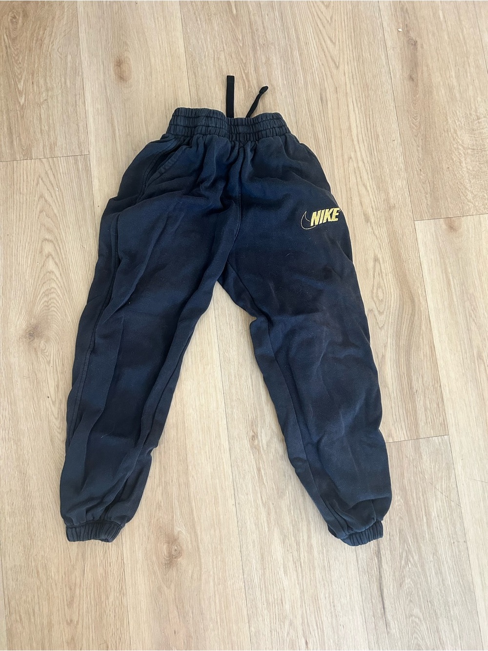 Nike Kids Navy Sweatpants with Yellow Logo